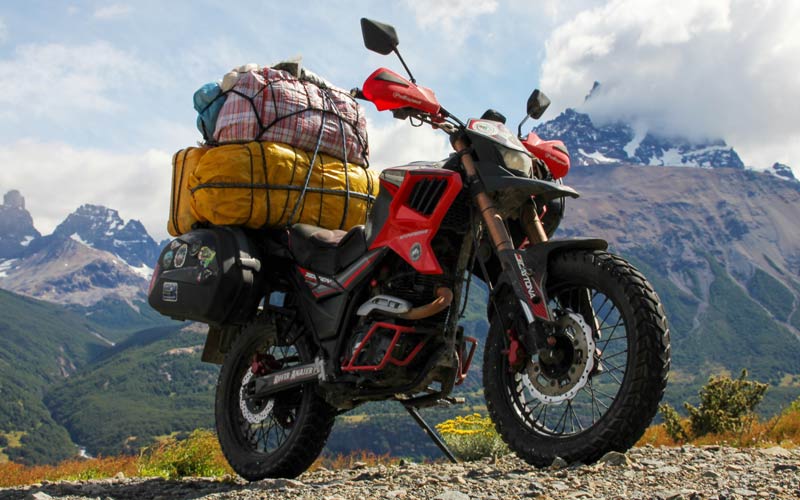 Honda trail motorcycle loaded with luggage