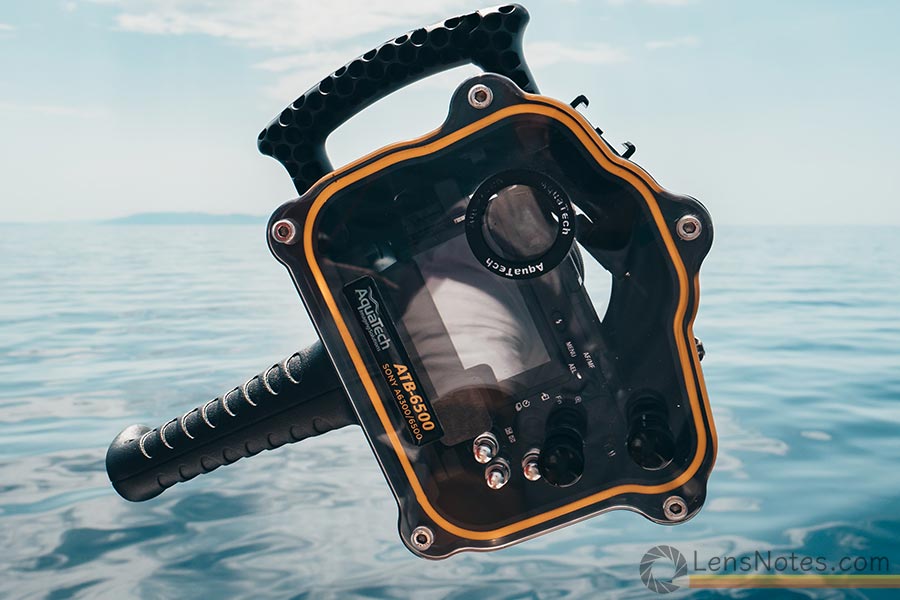 Sony A6500 mirrorless camera in a AquaTech underwater housing with a pistol grip on the bottom