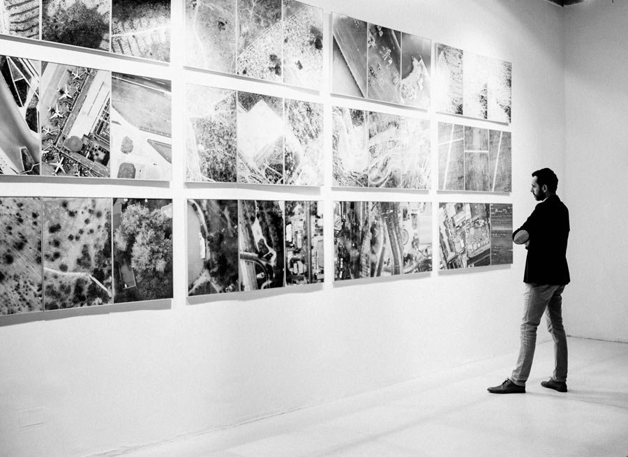Black and white photographic prints in a gallery