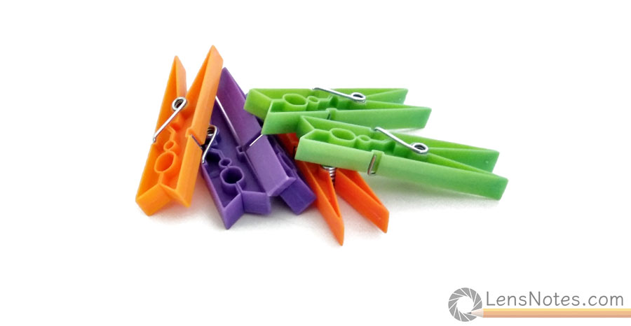 orange, purple and green plastic clothes pins